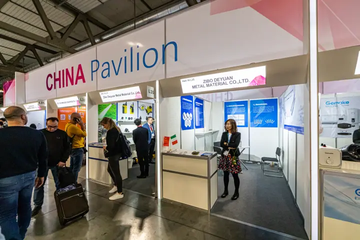 Zibo Deyuan Metal Material booth with anode posters in the China Pavilion at MCE 2024