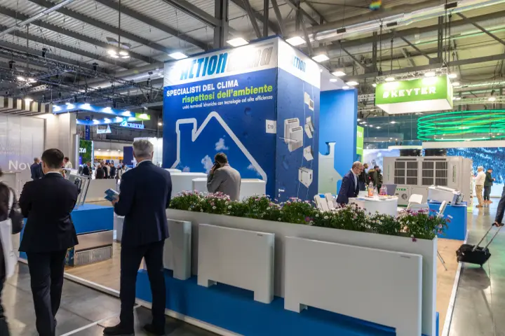 Action Clima stand front with flower planter and floor fan coils at MCE 2026