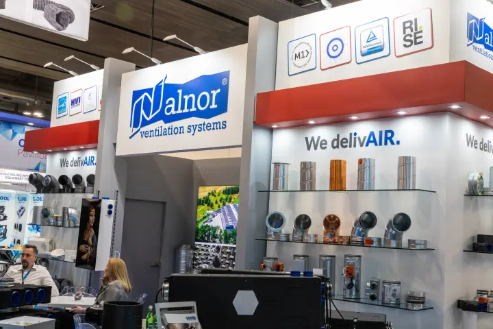 Alnor signage above shelves of spiral duct, elbows and dampers