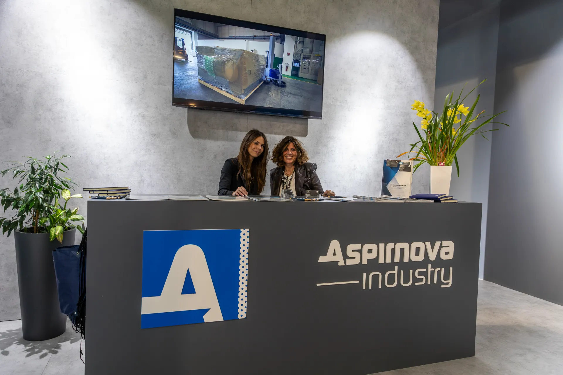 Aspirnova Industry reception desk with catalogues and video screen at MCE 2026