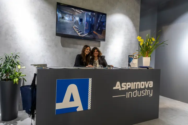 Aspirnova Industry reception desk with factory video of fan units at MCE 2026