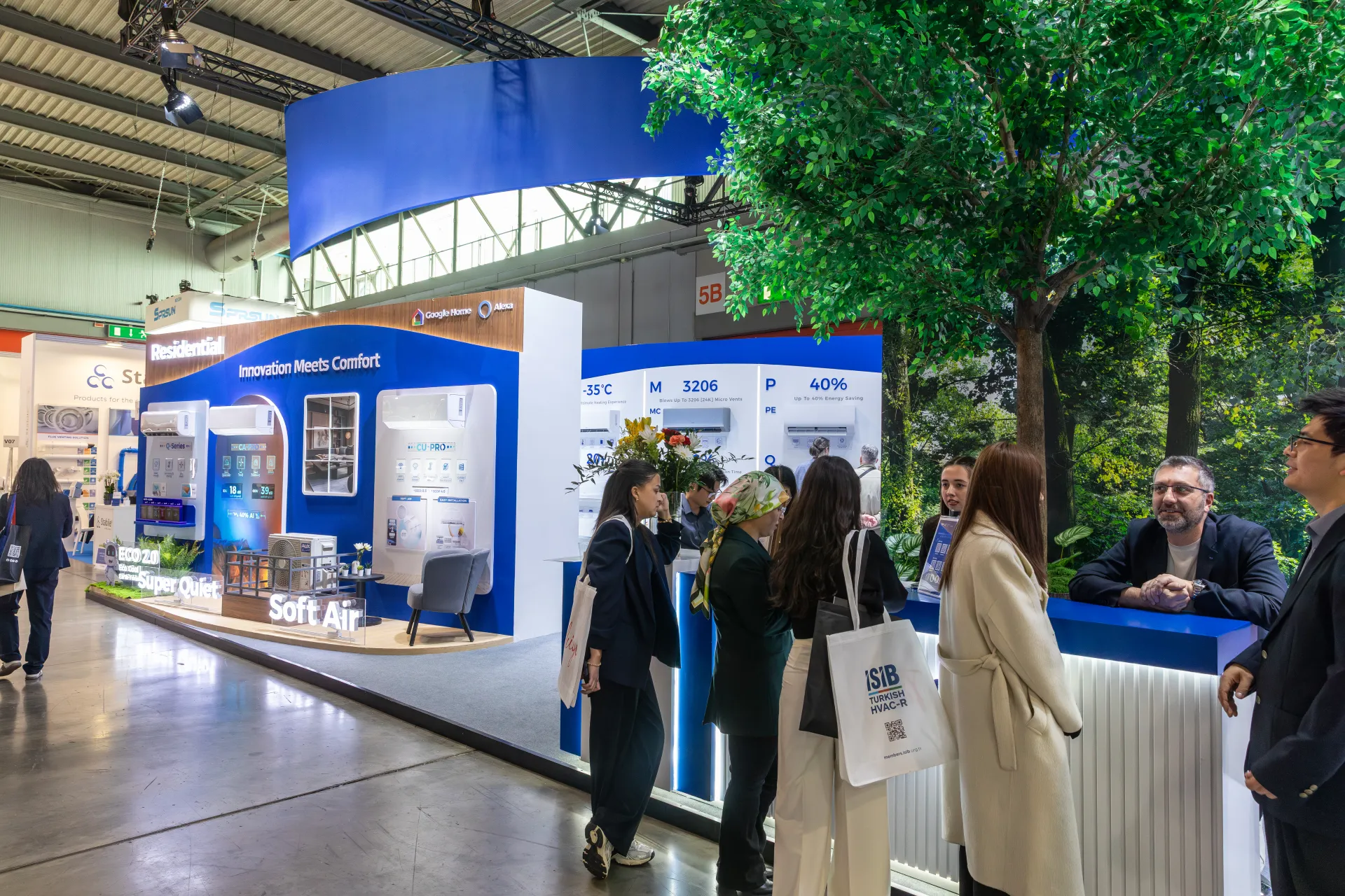 AUX residential air conditioner wall and busy reception counter at MCE 2026