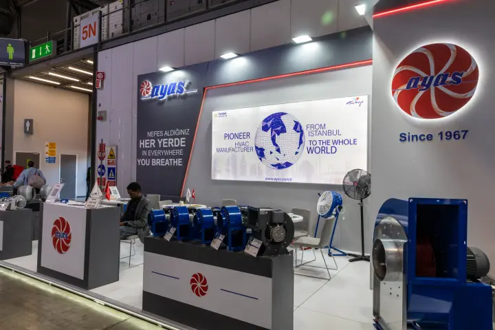Ayas stand corner with a large centrifugal fan and the Since 1967 logo wall at MCE 2026