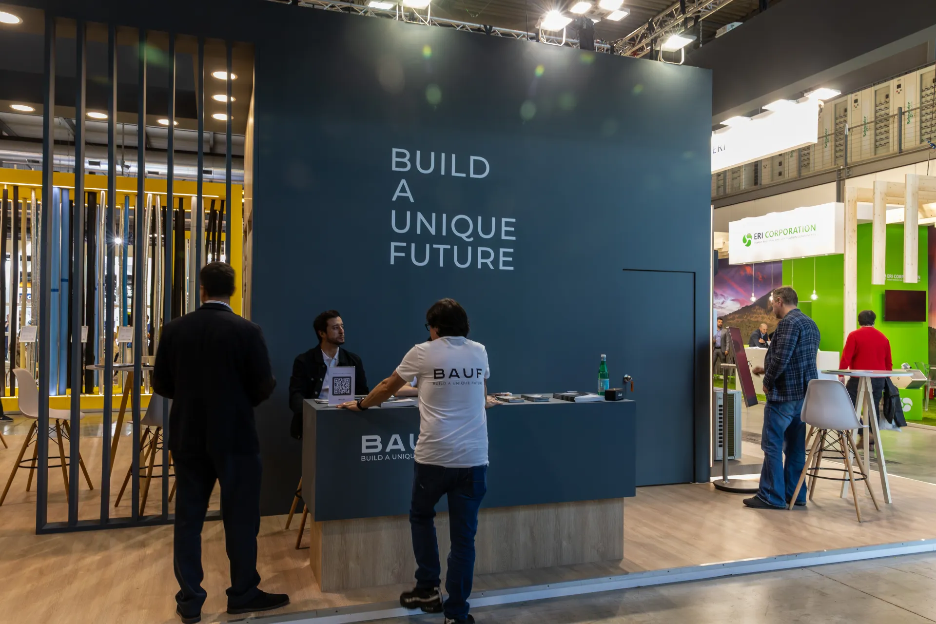 BAUF reception counter in front of a 'Build a Unique Future' wall at MCE 2026