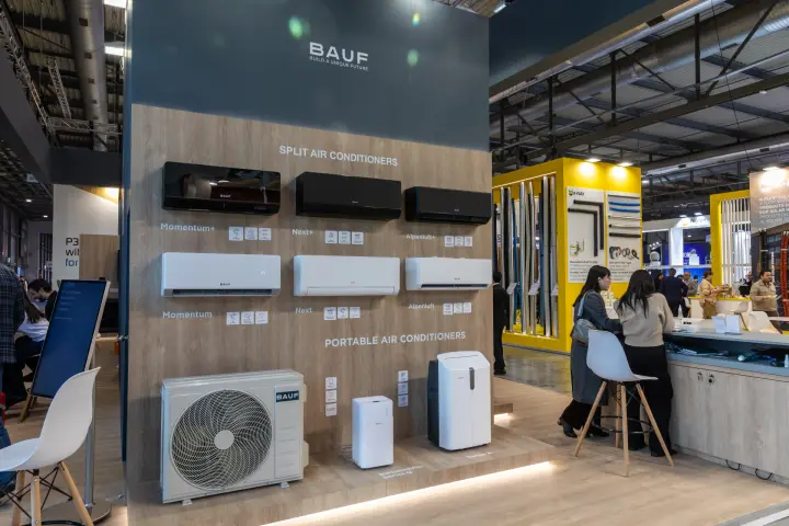 BAUF split and portable air conditioners on an oak-effect wall