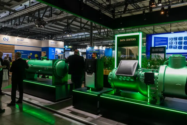 Bitzer compressor, shell-and-tube vessel and drive on green-lit plinths at MCE 2026