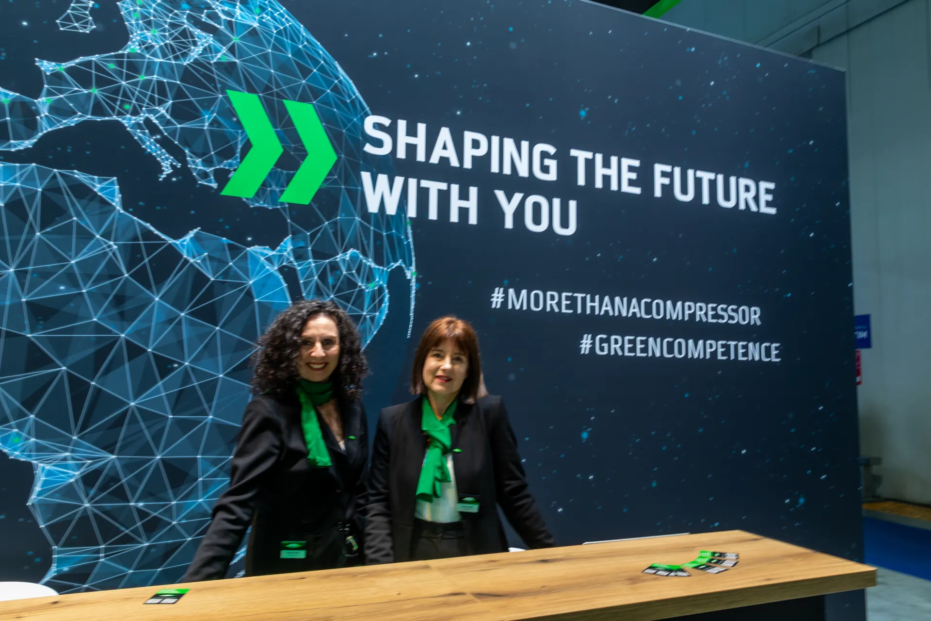 Bitzer reception counter with 'Shaping the future with you' slogan wall at MCE 2026