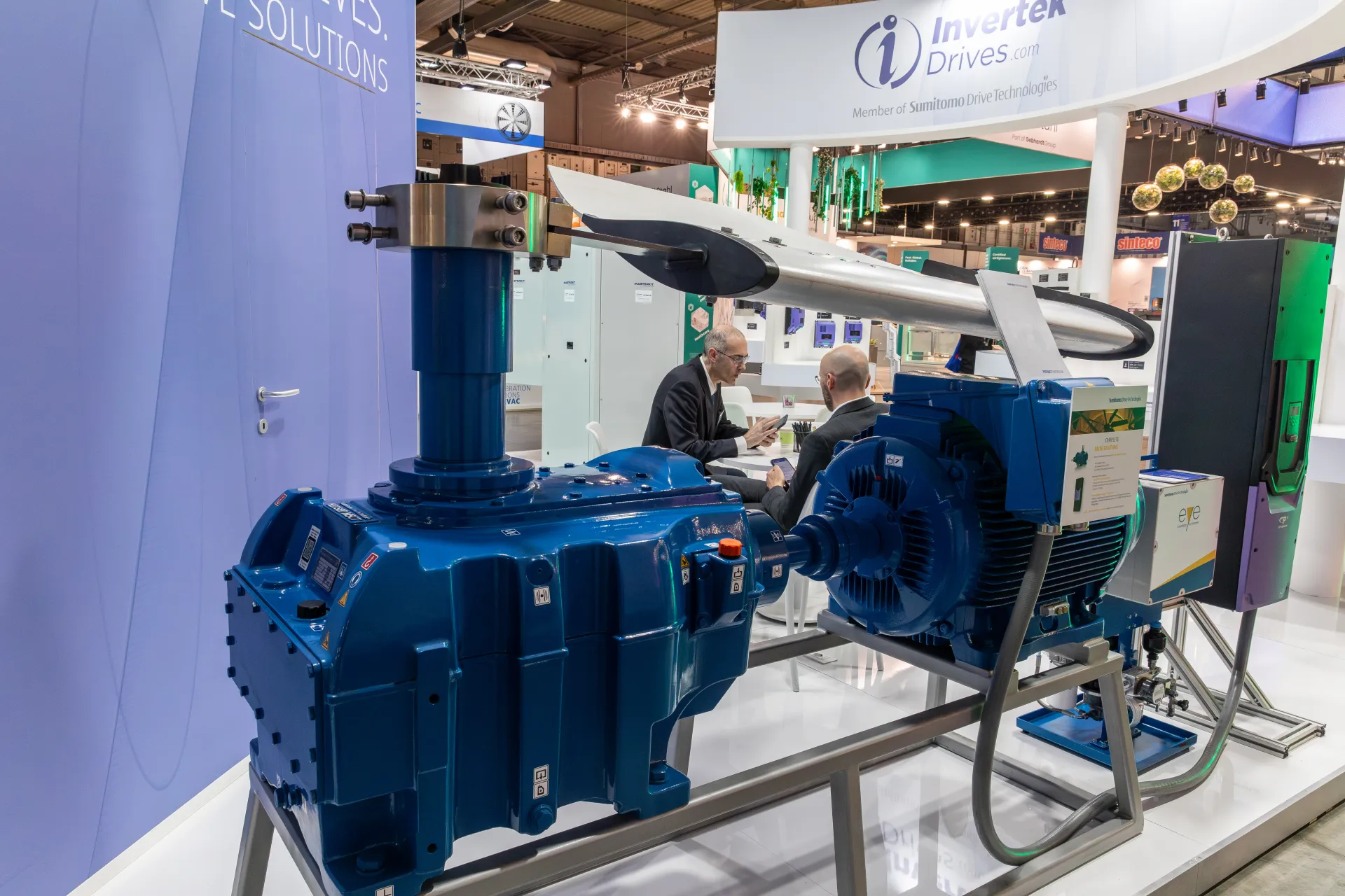 Blue gearbox and motor assembly with fan blade, side view at MCE 2026
