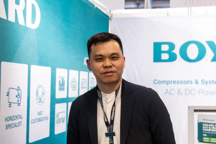 Boyard staff member in front of compressor branding at MCE 2026