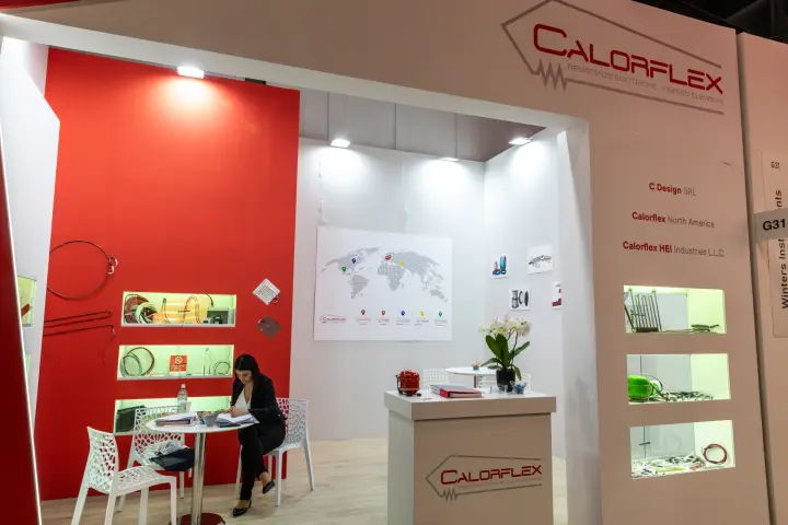 Calorflex stand with electric heating elements in lit niches at MCE 2026