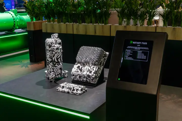 Camouflage-wrapped Bitzer compressor parts beside a 'Rotary F320' kiosk at MCE 2026