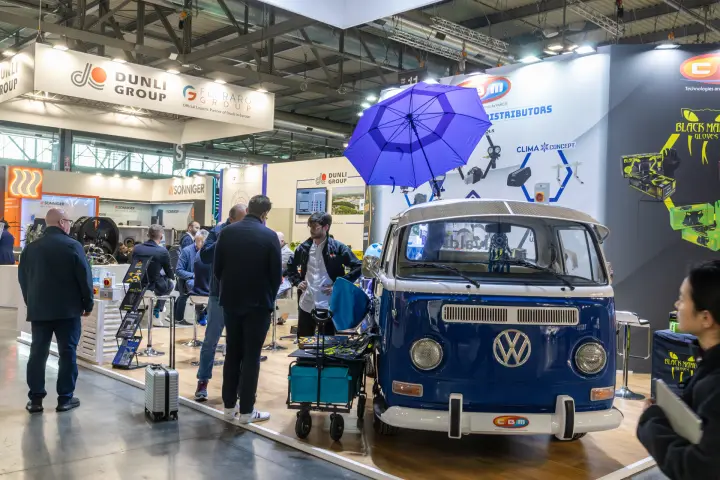 CBM stand with a blue vintage Volkswagen van and roof umbrella at MCE 2026
