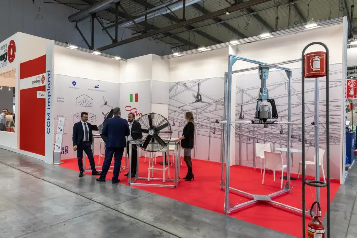 CGM Impianti stand with a ceiling fan hub in a demo frame and a circulation fan