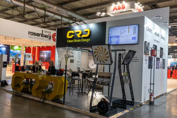 CRD Clean Room Design stand with swirl diffusers and yellow logo counter