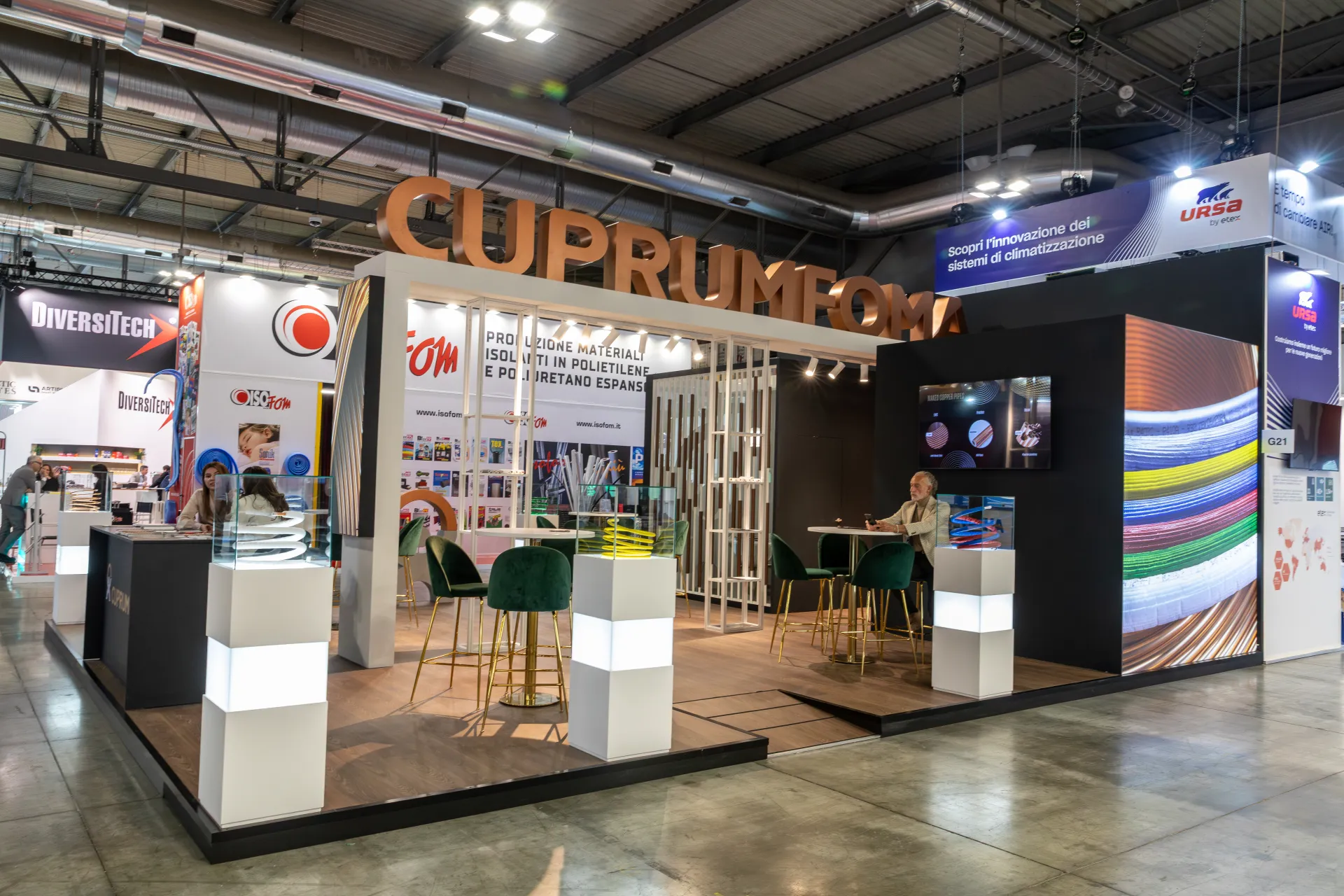 Cuprumfoma stand with copper-effect lettering and insulated pipe displays at MCE 2026
