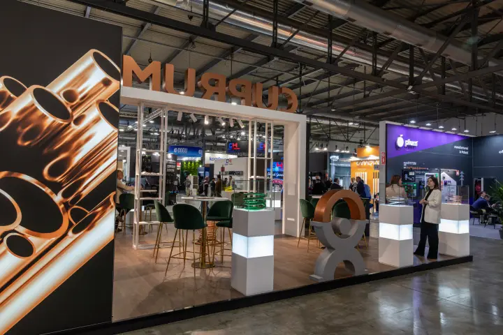 Cuprumfoma stand with copper lettering and illuminated tube displays