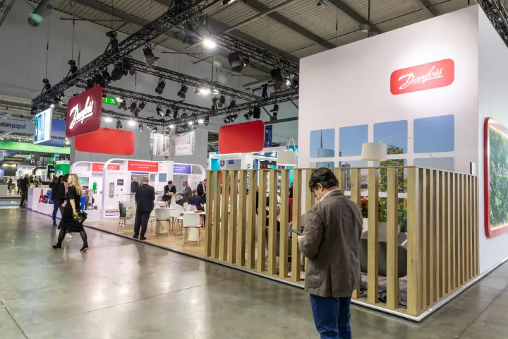 Danfoss stand with timber slat screen around a lounge area at MCE 2026
