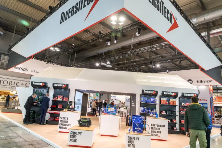 DiversiTech stand with HVAC tool displays under a suspended red-edged banner at MCE 2026