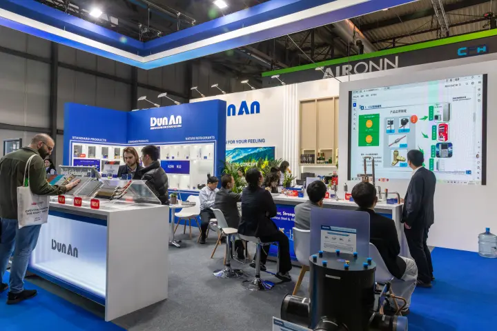 DunAn stand with heat exchanger counter and screen presentation at MCE 2026