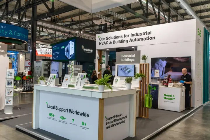 E+E stand corner with sensor displays and Local Support Worldwide counter at MCE 2026