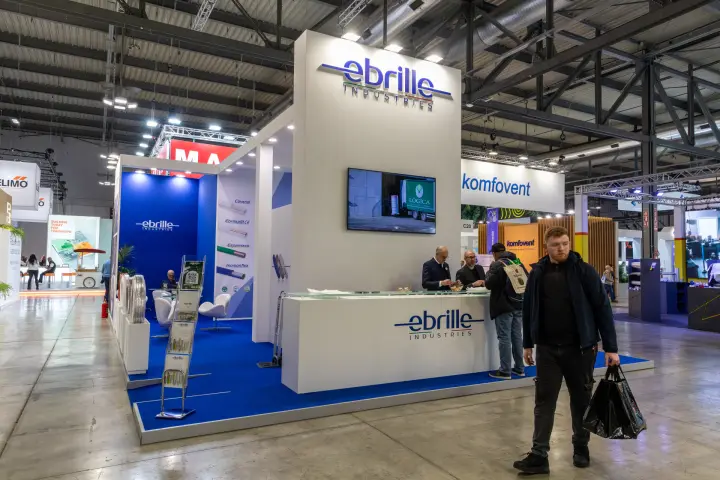 Ebrille Industries stand with blue carpet and branded reception counter