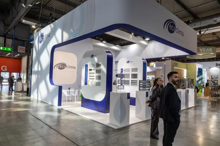 Ecoclima stand corner with grille samples and rainbow line graphics at MCE 2026