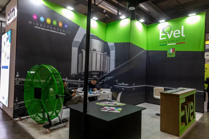 Evel stand with HVLS fans and a green portable industrial fan at MCE 2026
