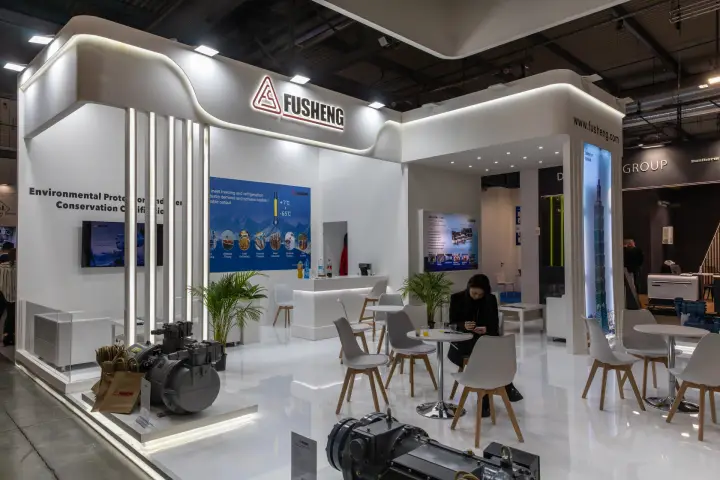 Fusheng stand with screw compressors and a white lounge area at MCE 2026