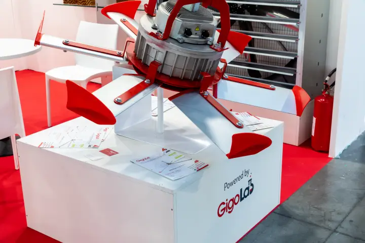 Gigola large ceiling fan hub with red winglets, powered by GigoLab at MCE 2026