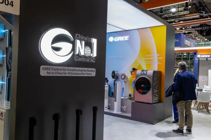 Gree "China's No.1 Central AC" sign beside fans and heat pump dryer