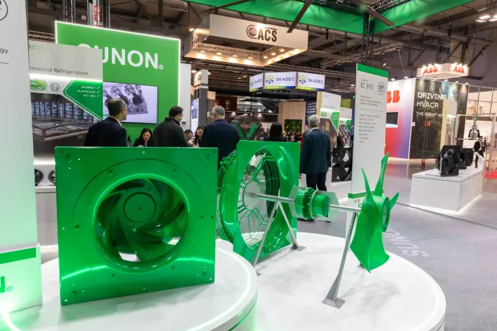 Green-painted Sunon centrifugal and axial fans on a round display plinth at MCE 2026