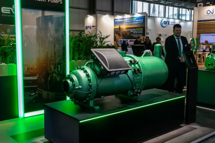 Green screw compressor on a black plinth with green LED edge lighting