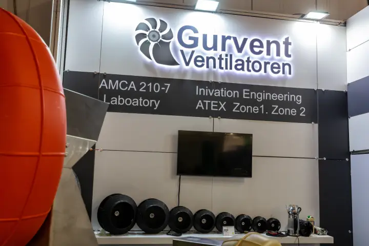 Gurvent backwall with illuminated logo and row of plastic impellers