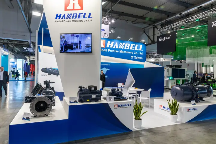 Hanbell stand corner with compressors, plants and white lounge at MCE 2026