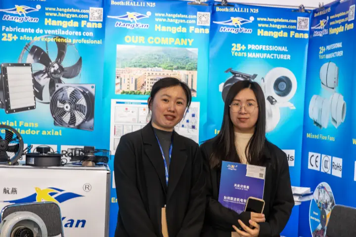 Hangda Fans staff in front of HangYan axial and inline fan banners at MCE 2026