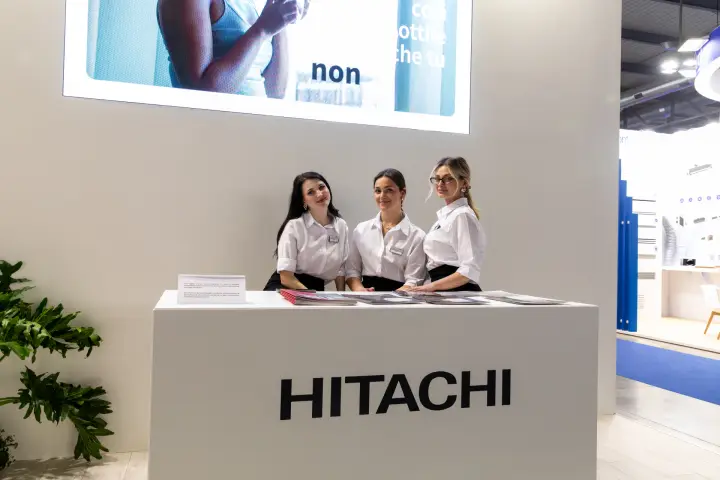 Hitachi reception desk with staff below a large LED screen at MCE 2026
