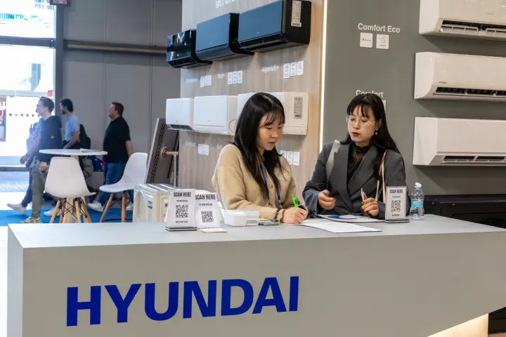 Hyundai reception desk with QR catalogue stands and wall-mounted units at MCE 2026