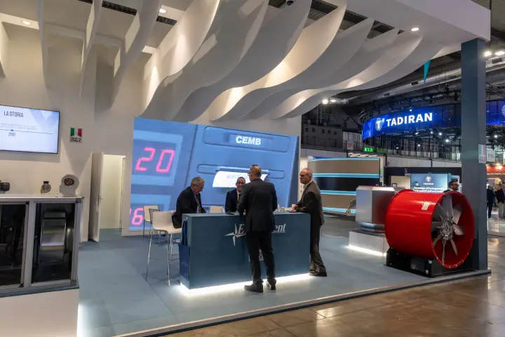 Inside the Elektrovent stand: wave ceiling, LED wall and red axial fan
