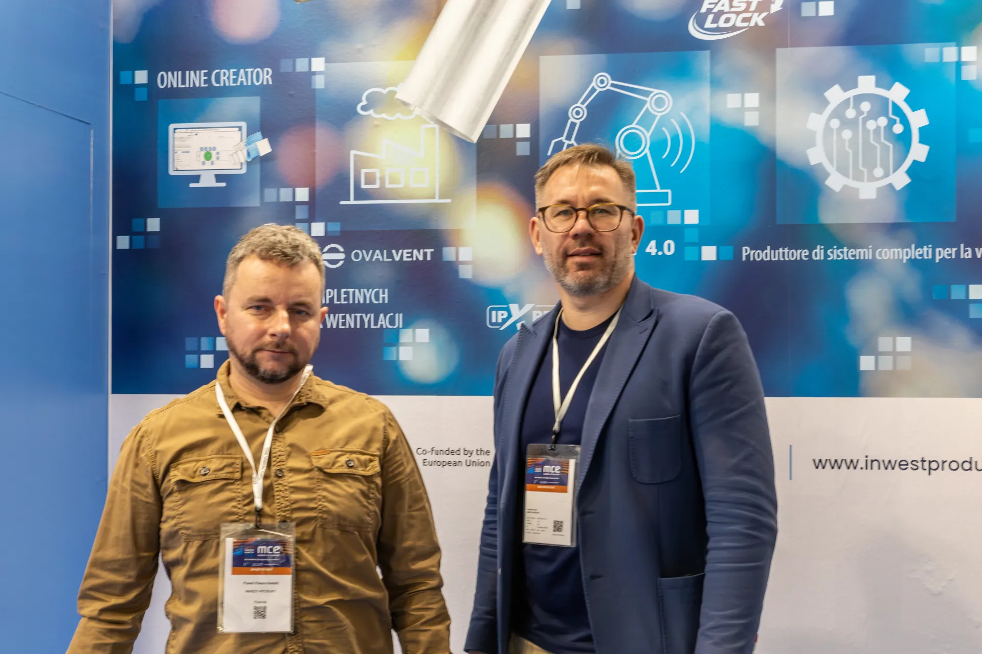Inwest Produkt staff in front of the Ovalvent and Fast Lock brand wall at MCE 2026