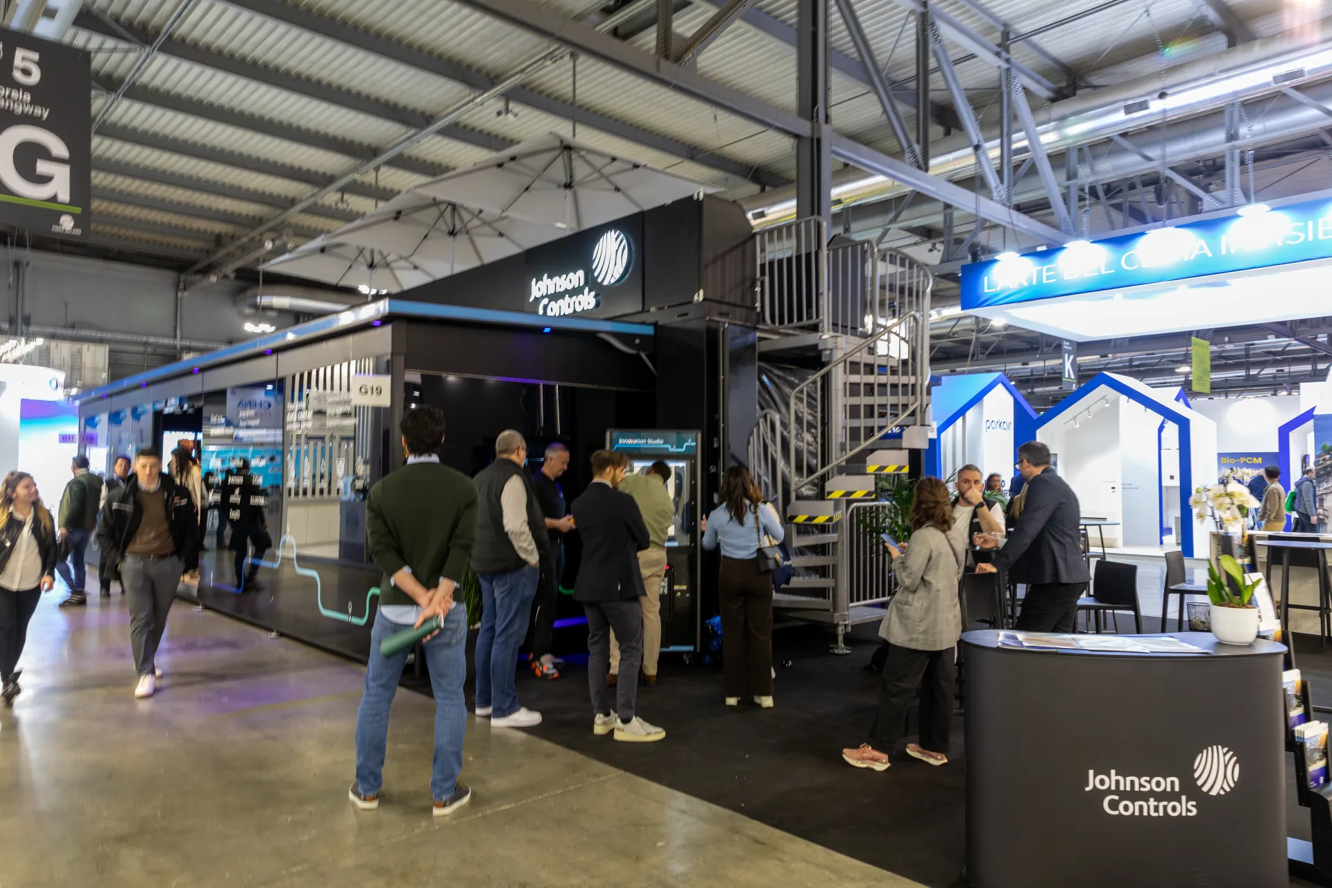 Johnson Controls black stand with spiral staircase and Innovation Studio kiosk at MCE 2026