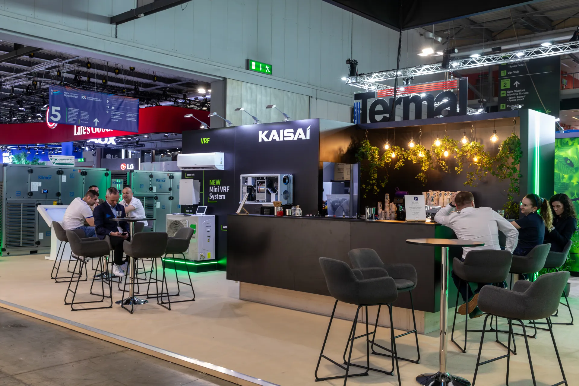 Kaisai stand café bar with hanging plants and Mini VRF display at MCE 2026