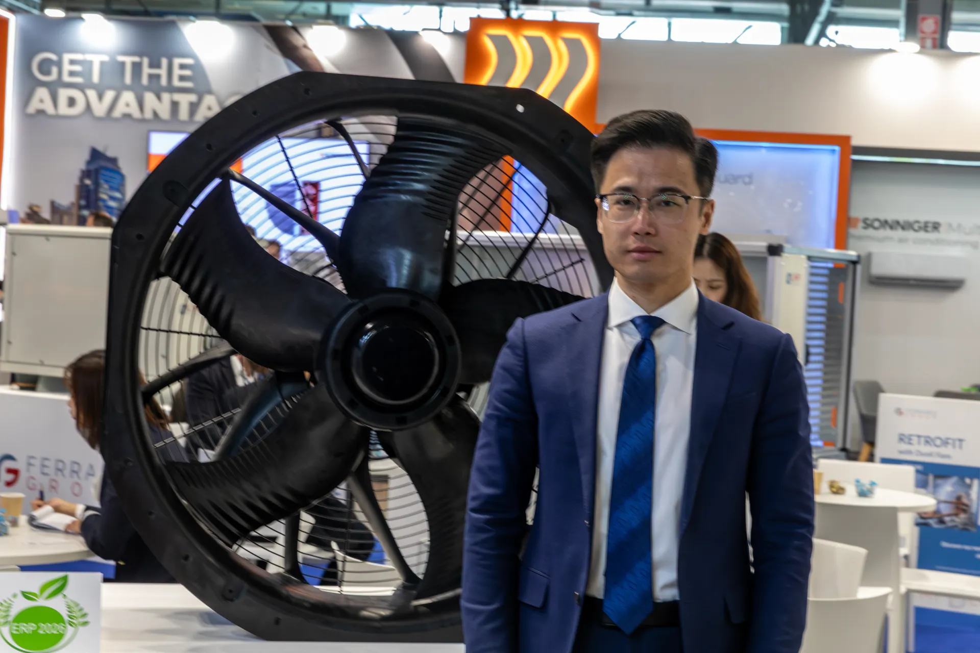 Large black axial fan with ERP 2020 label on a white counter at MCE 2026
