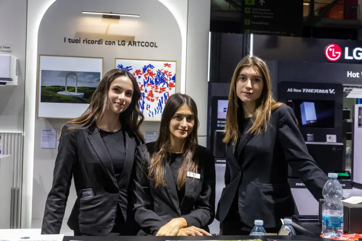 LG stand staff in front of the LG ARTCOOL art wall at MCE 2026