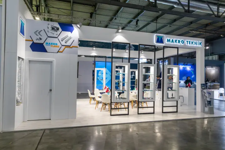 Makro Teknik stand with duct flange profiles and fittings in display cases at MCE 2026