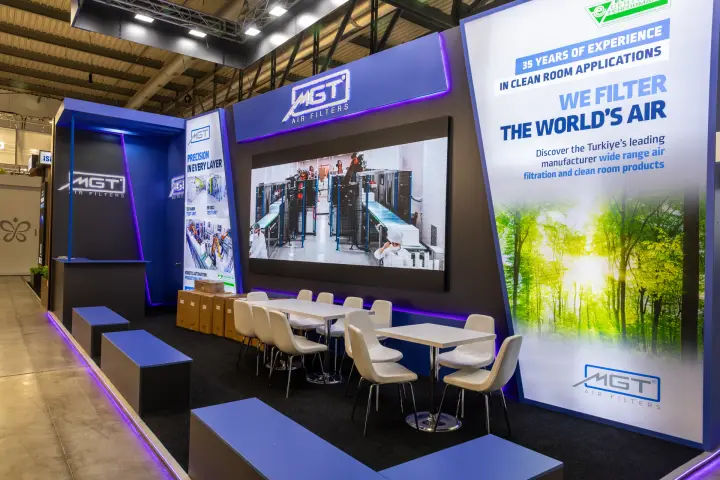 MGT Air Filters stand with LED wall showing its filter production line