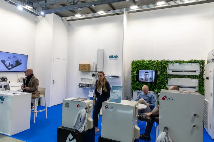 Mi.Air and Artix stand with water-condensed air conditioners and a green wall at MCE 2026