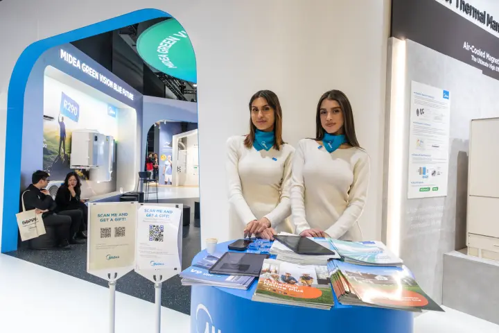 Midea information desk with brochures and Green Vision Blue Future arch at MCE 2026