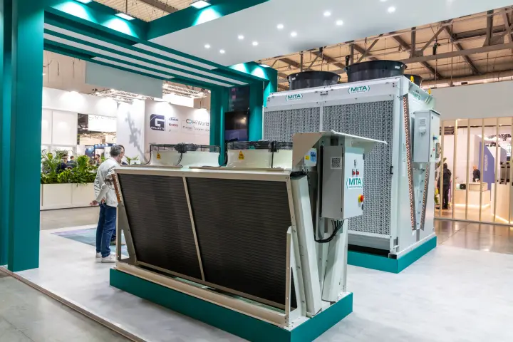 Mita dry cooler and adiabatic cooler on a teal and white stand