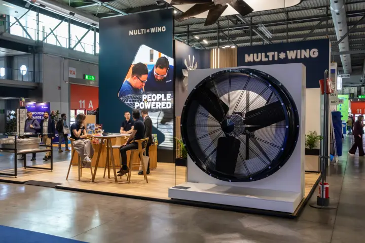 Multi-Wing large axial fan display beside 'People Powered' screen at MCE 2026