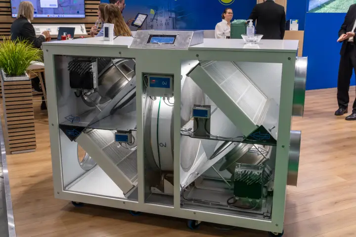 OJ Electronics demo heat recovery unit with open panels and airflow labels at MCE 2026
